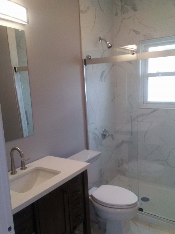 135 Winthrop Street Fall River, MA 02721 - Photo 18 of 26 a bathroom with a sink toilet and shower