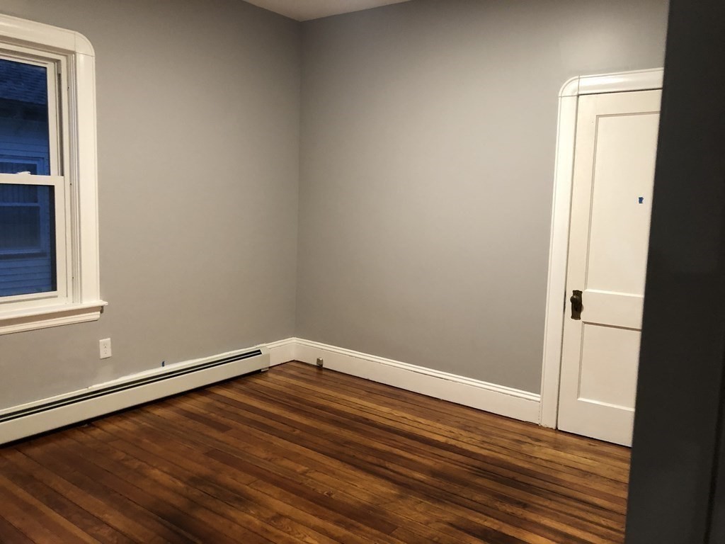 135 Winthrop Street Fall River, MA 02721 - Photo 19 of 26 a view of empty room with wooden floor