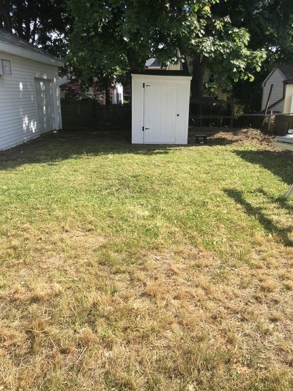 135 Winthrop Street Fall River, MA 02721 - Photo 7 of 26 a house with trees in front of it