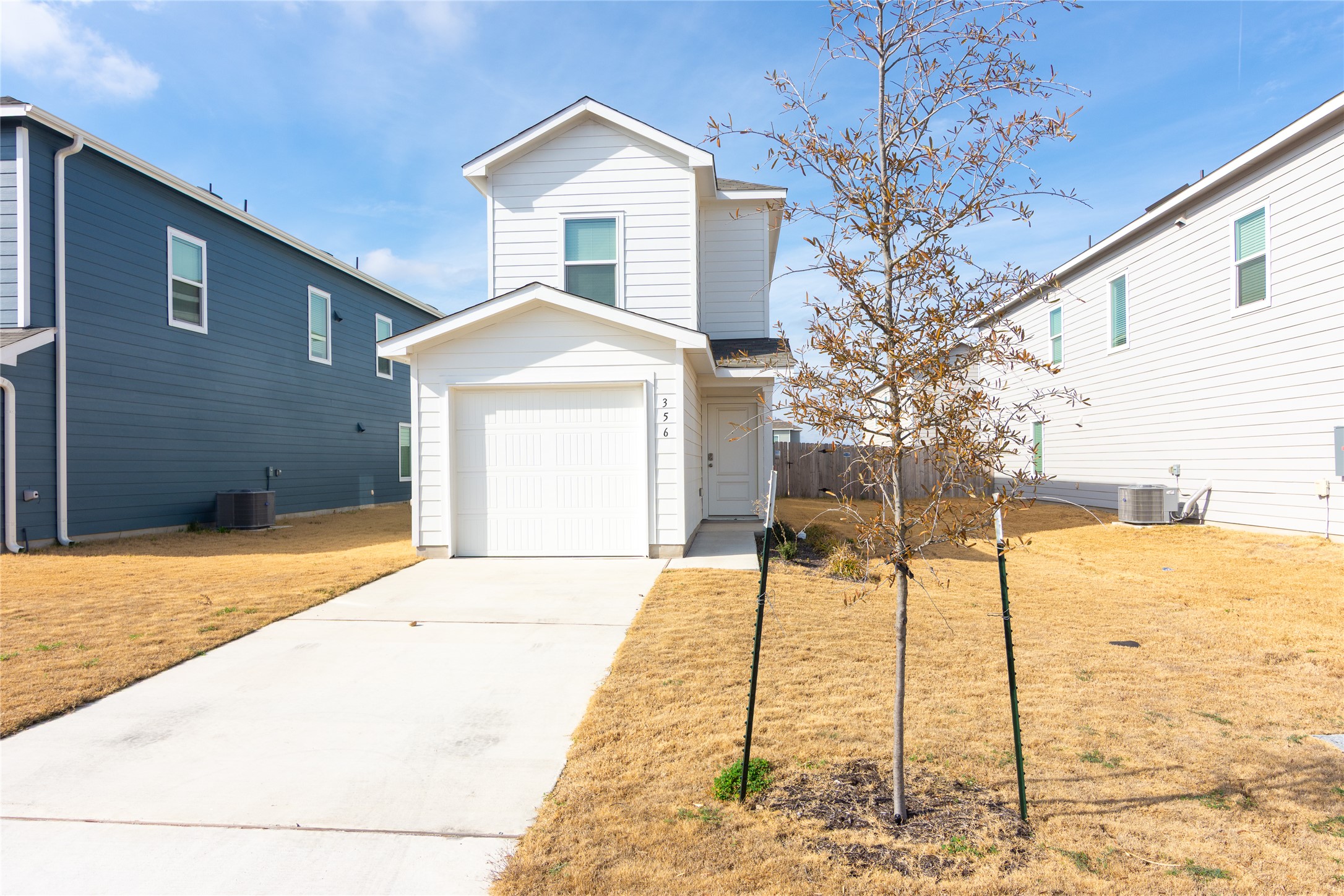 356 Marty Allen Loop Jarrell, TX 76537 - Photo 1 of 33 a front view of a house with trees