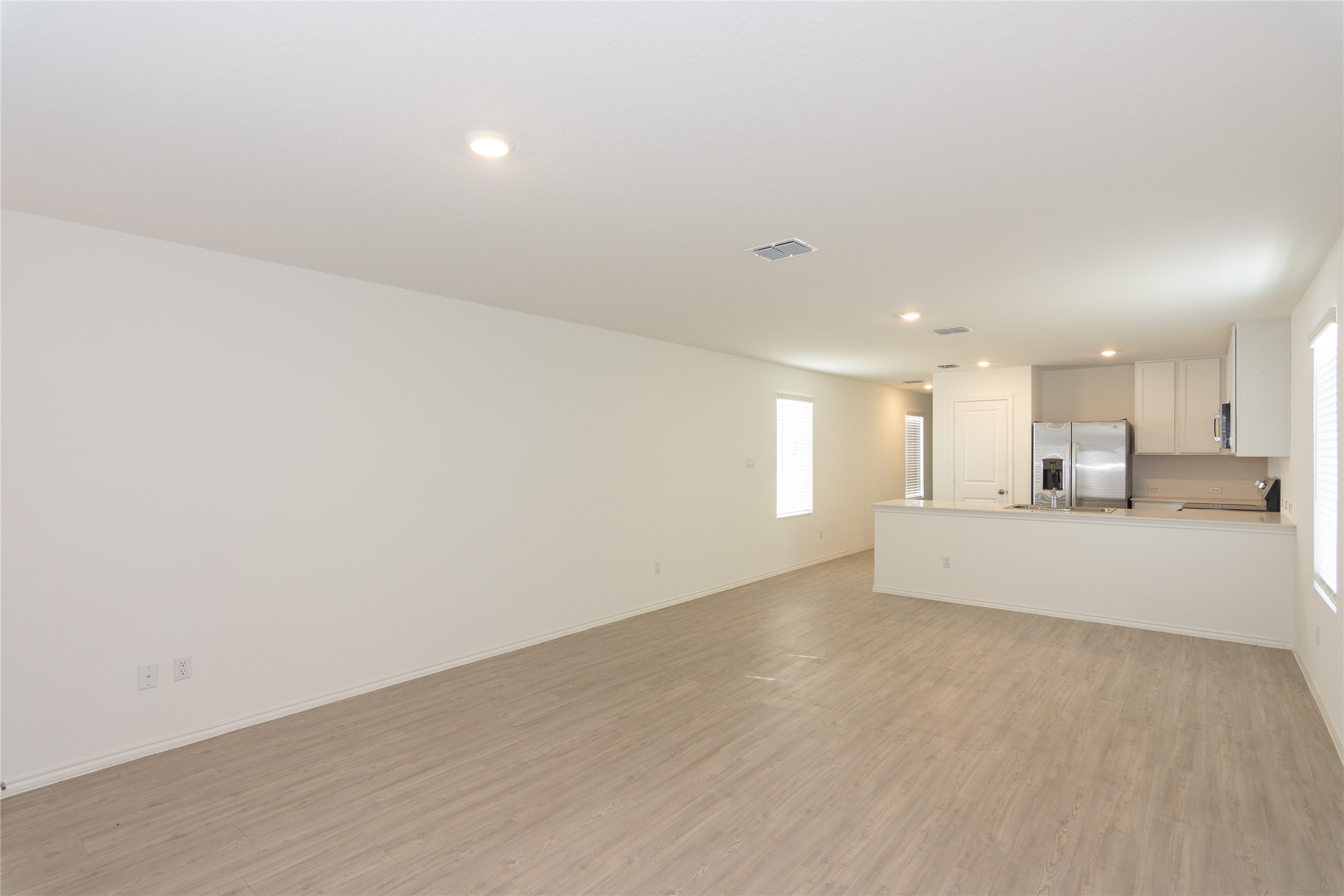 356 Marty Allen Loop Jarrell, TX 76537 - Photo 10 of 33 a view of empty room with wooden floor