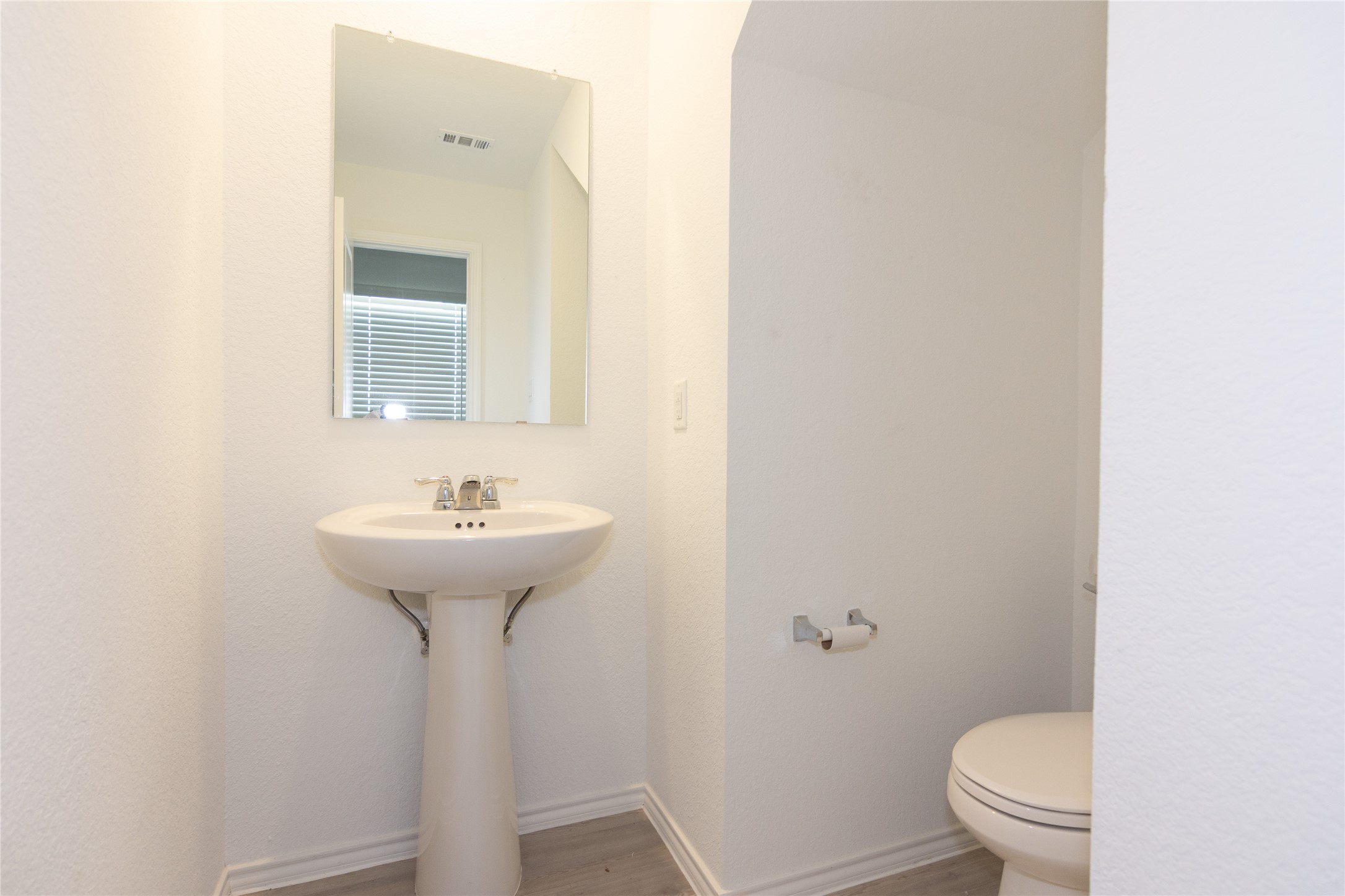356 Marty Allen Loop Jarrell, TX 76537 - Photo 12 of 33 a bathroom with a sink toilet and a mirror