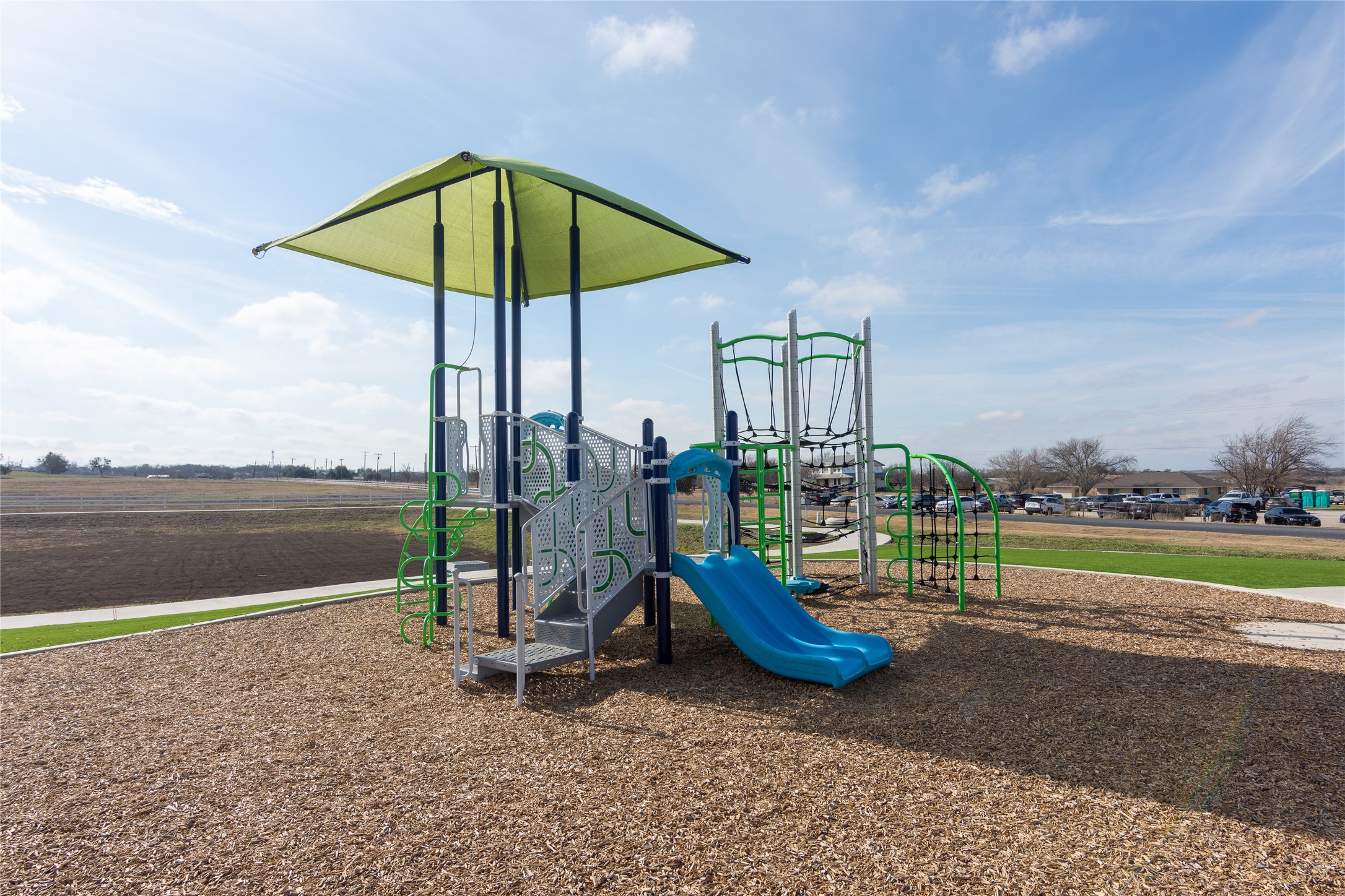 356 Marty Allen Loop Jarrell, TX 76537 - Photo 27 of 33 a view of a lake with a slide and a table