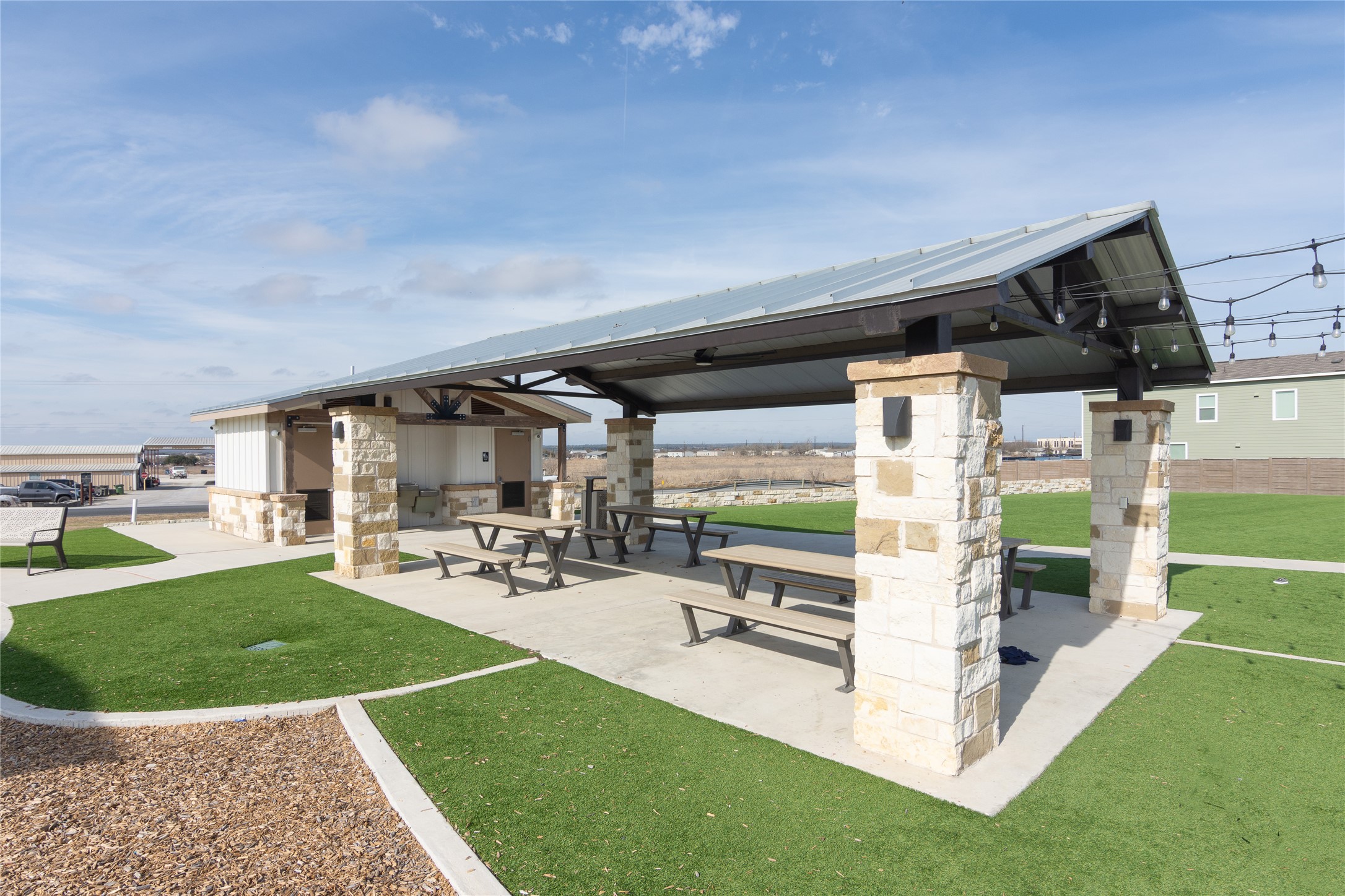 356 Marty Allen Loop Jarrell, TX 76537 - Photo 28 of 33 a view of a patio with table and chairs a barbeque with wooden fence