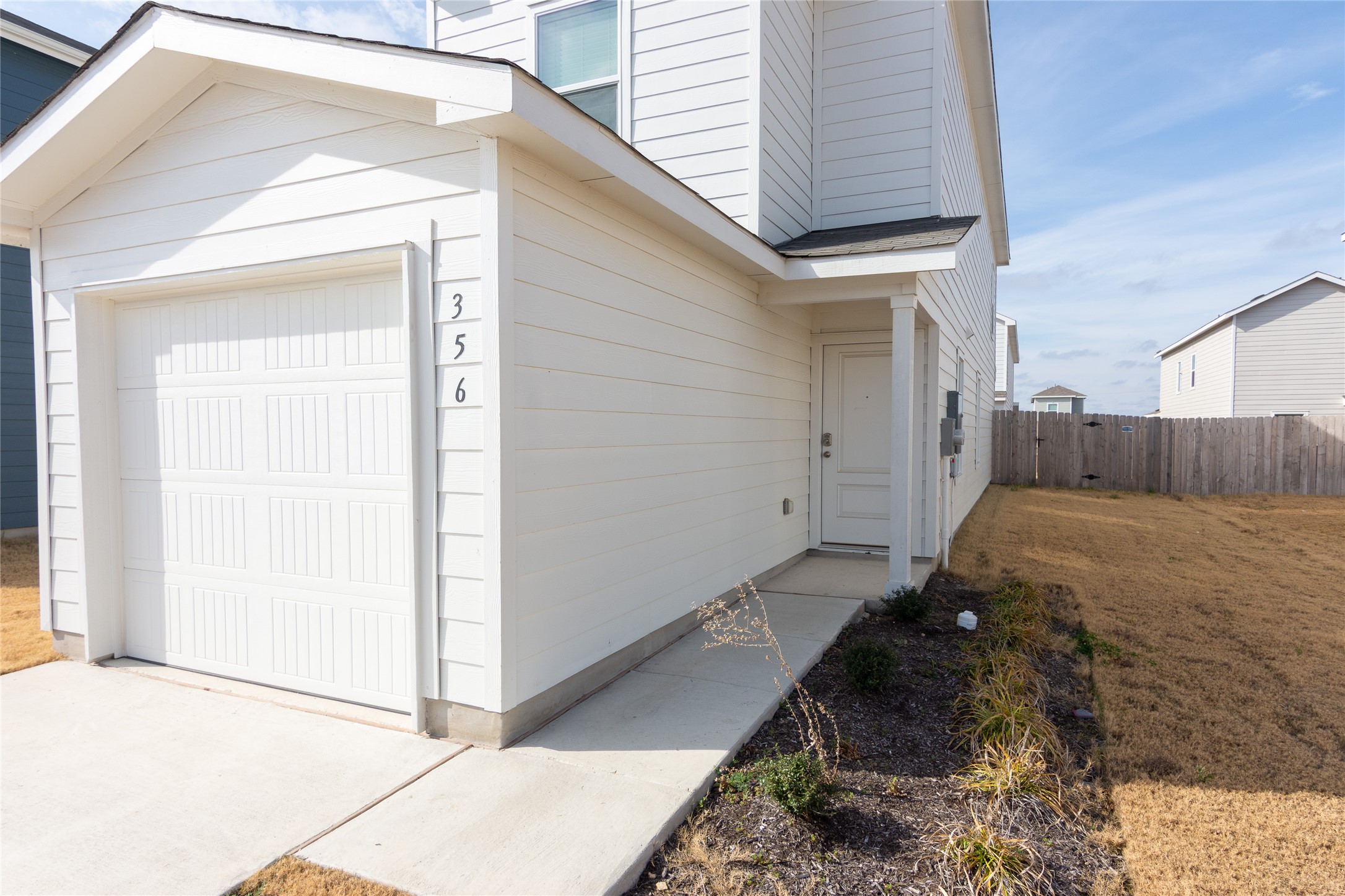 356 Marty Allen Loop Jarrell, TX 76537 - Photo 4 of 33 a house view with a backyard