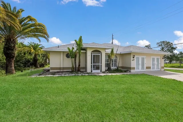 a front view of a house with swimming pool having outdoor seating
