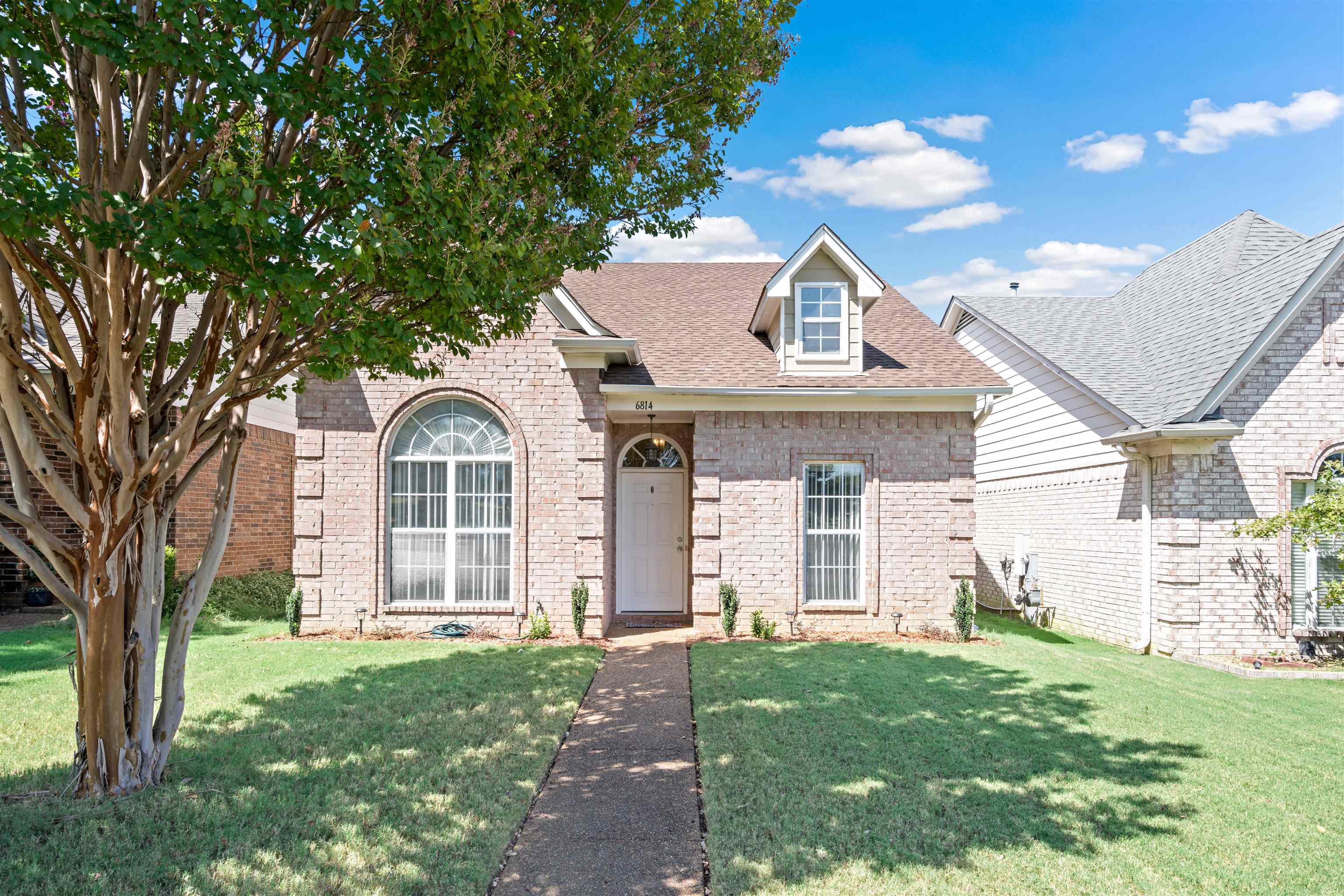 6814 Manslick Road Cordova, TN 38018 - Photo 1 of 20 View of front of home with a front lawn