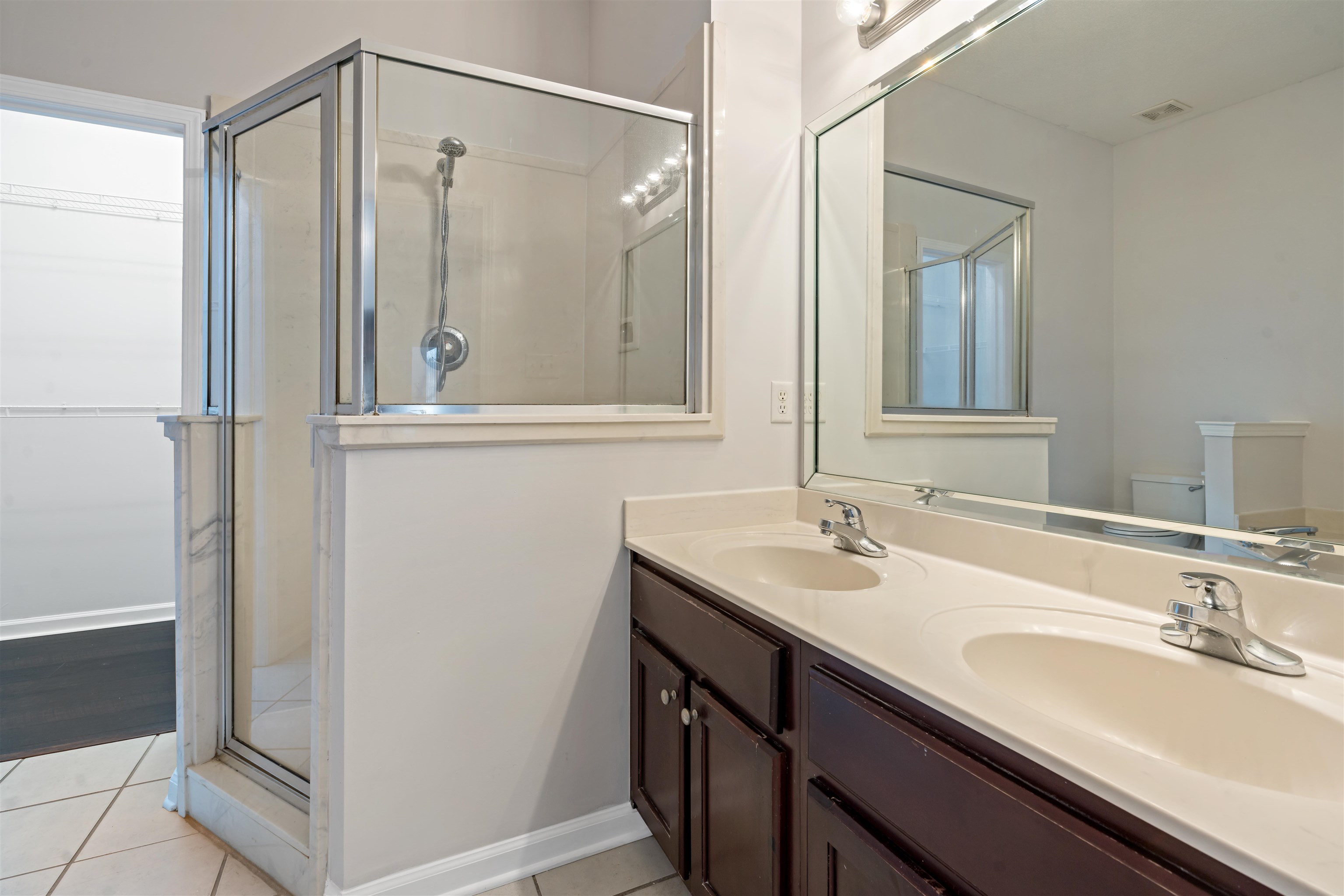 6814 Manslick Road Cordova, TN 38018 - Photo 11 of 20 Bathroom featuring toilet, tile patterned flooring, walk in shower, and vanity
