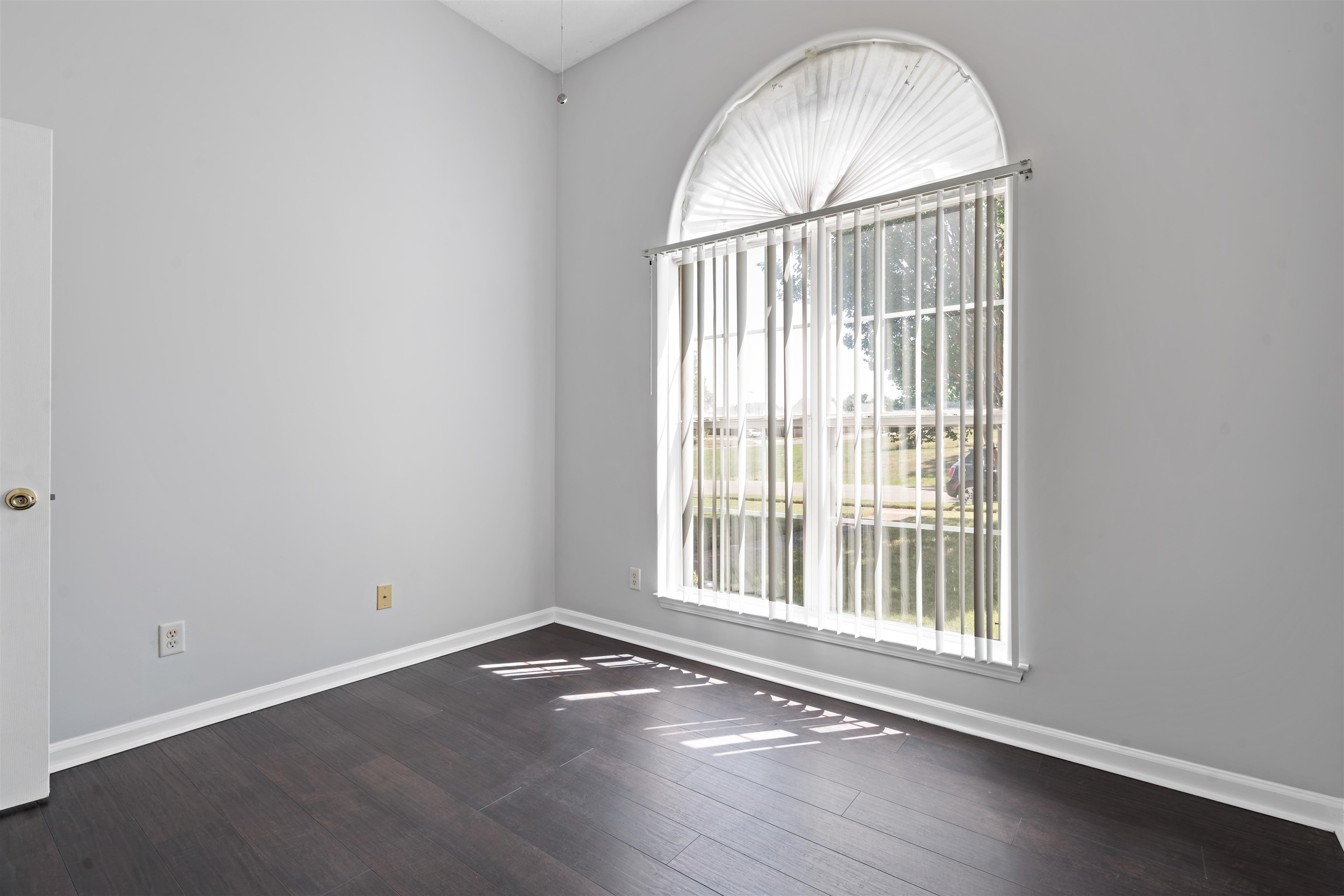 6814 Manslick Road Cordova, TN 38018 - Photo 13 of 20 Unfurnished room featuring hardwood / wood-style flooring and lofted ceiling