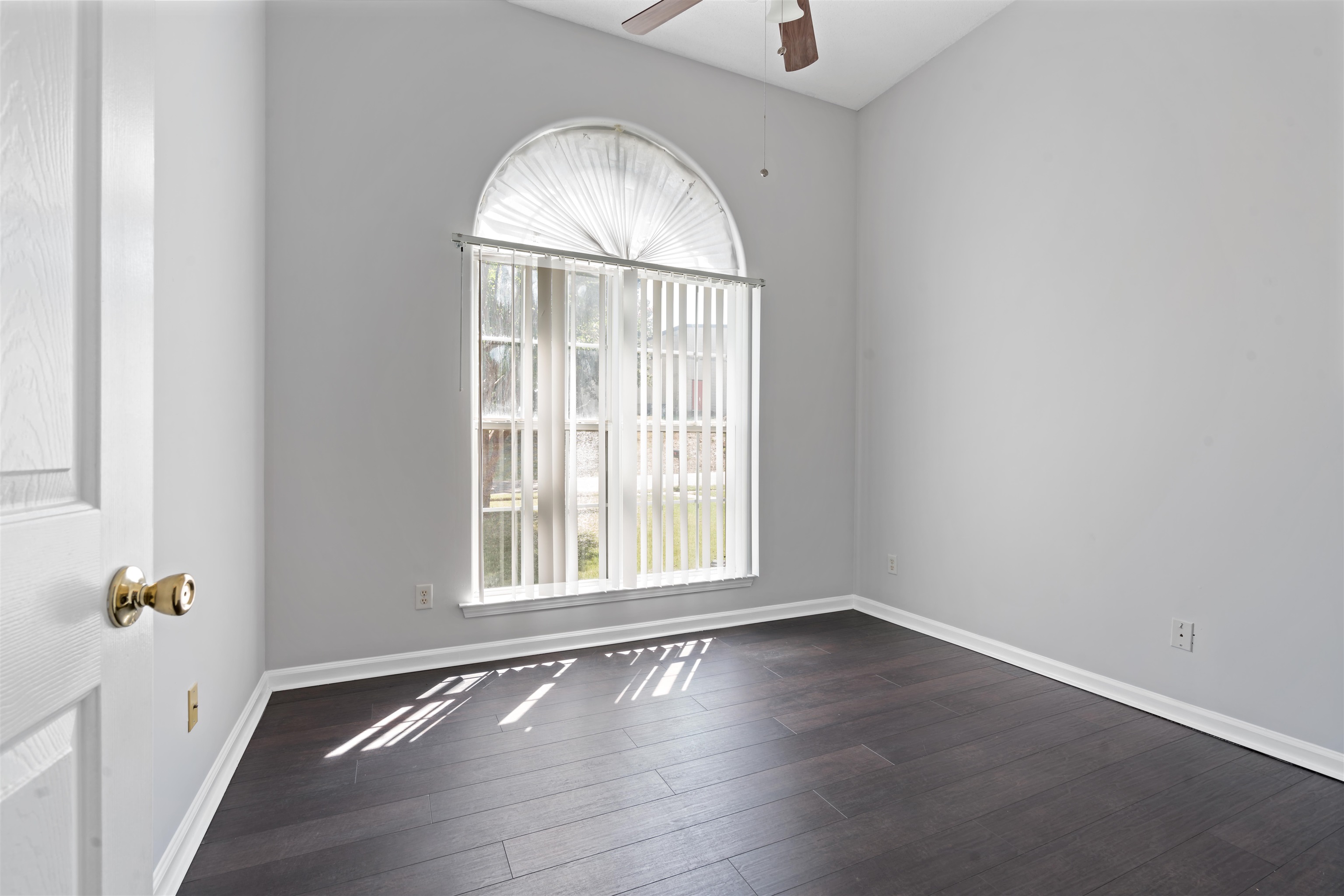 6814 Manslick Road Cordova, TN 38018 - Photo 14 of 20 Unfurnished room with ceiling fan and dark wood-type flooring