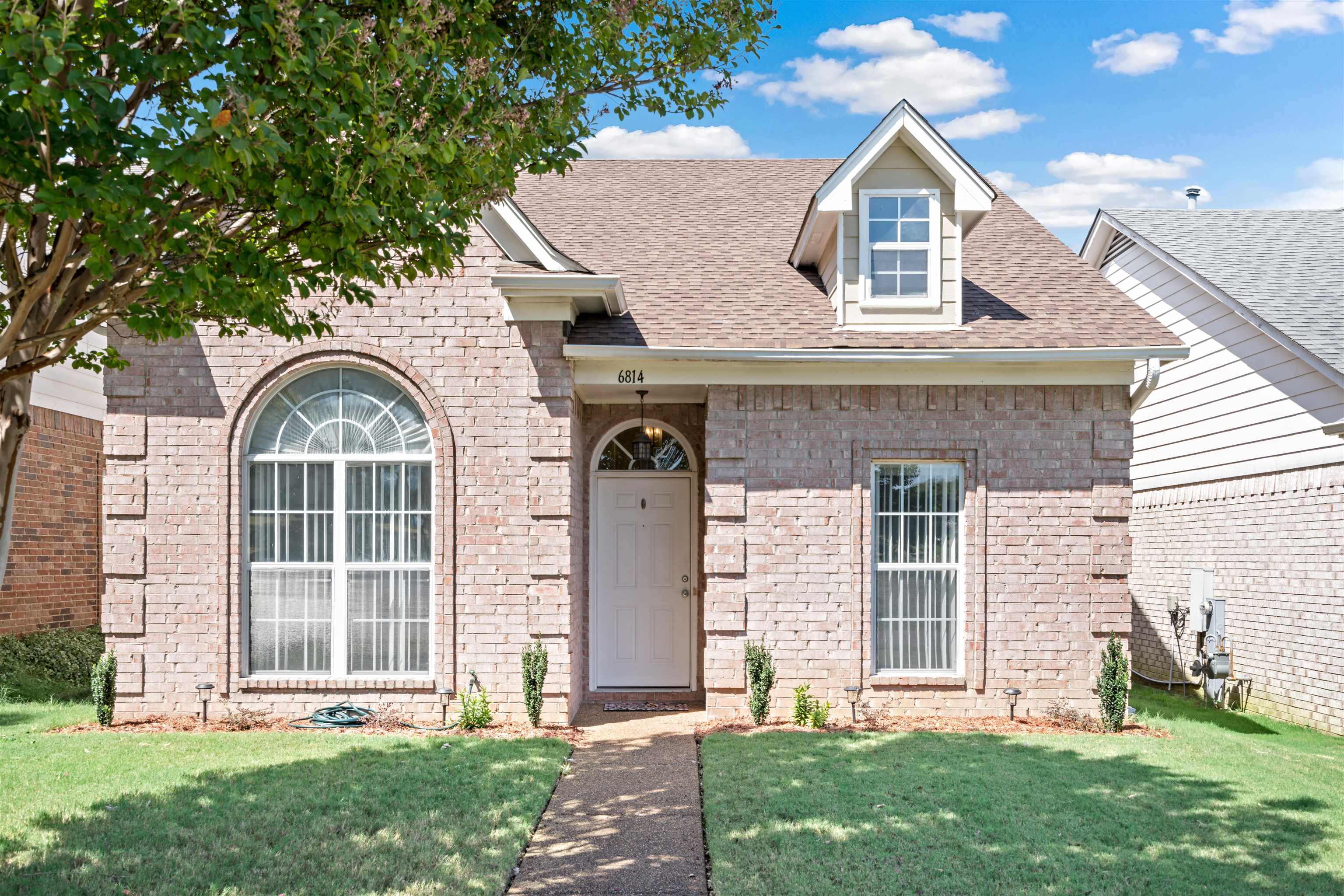 6814 Manslick Road Cordova, TN 38018 - Photo 2 of 20 View of front of property featuring a front yard