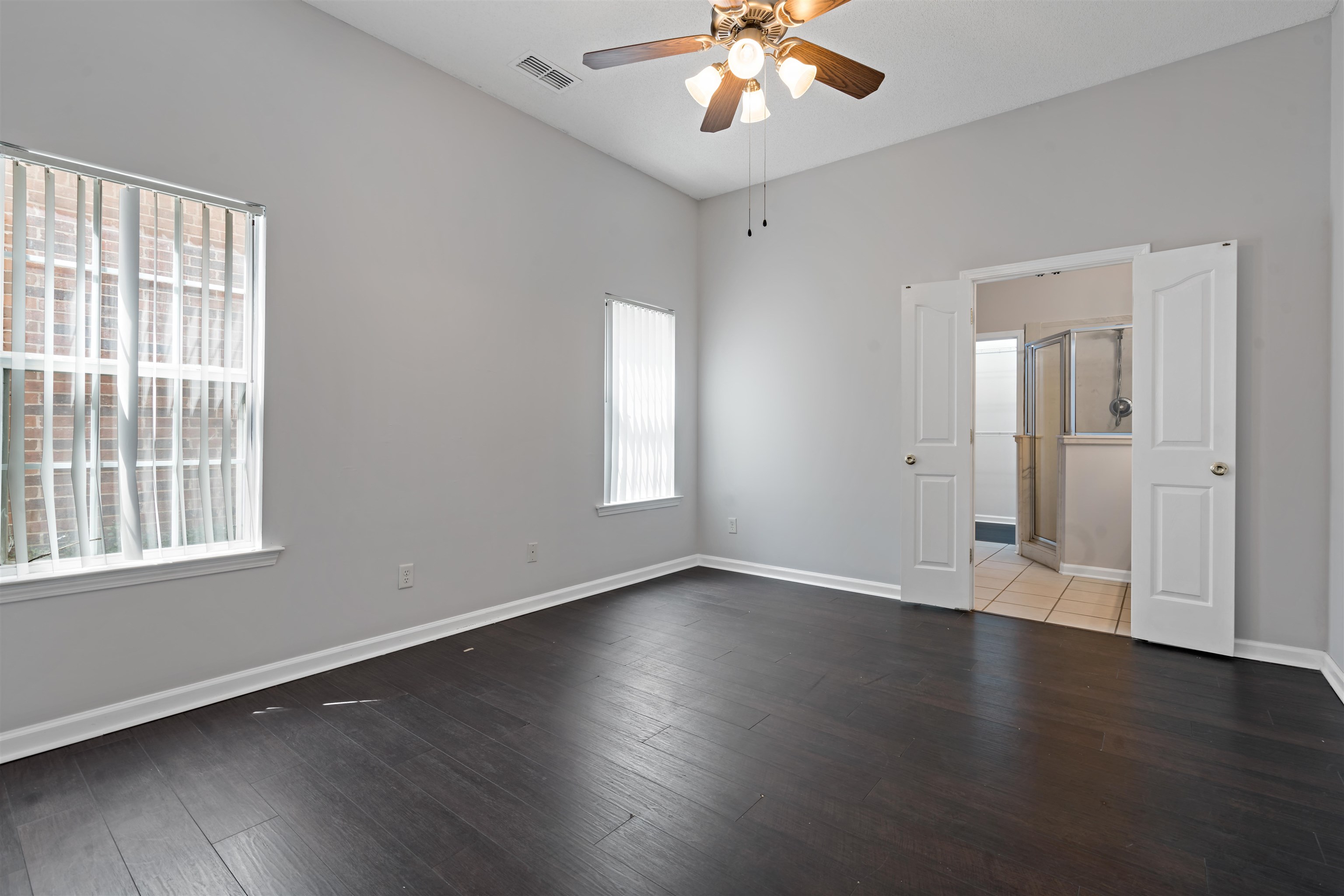 6814 Manslick Road Cordova, TN 38018 - Photo 8 of 20 Unfurnished room featuring ceiling fan, a wealth of natural light, and tile patterned flooring