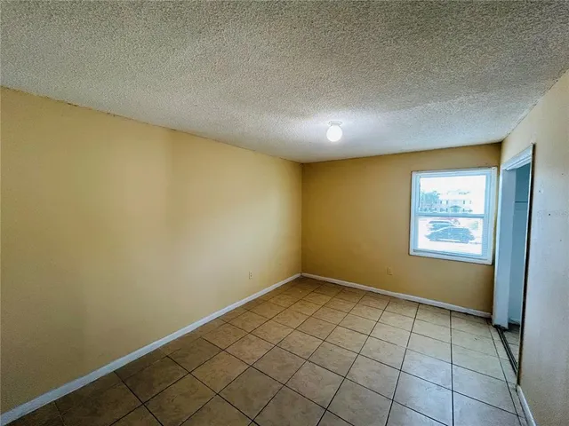 an empty room with a empty space and window