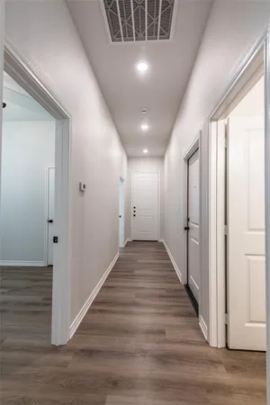 an empty room with a window and a ceiling fan
