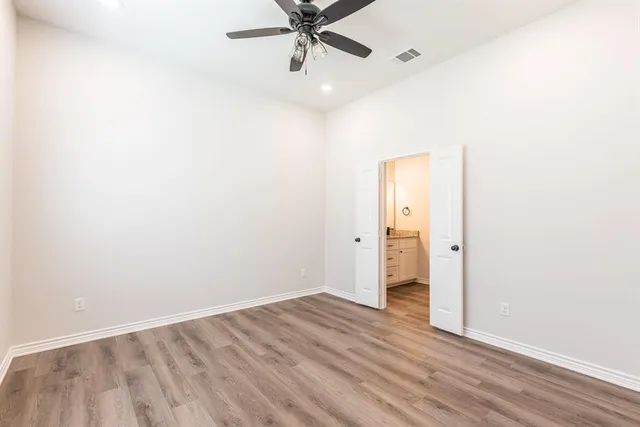 a bathroom with a granite countertop sink toilet and bathtub