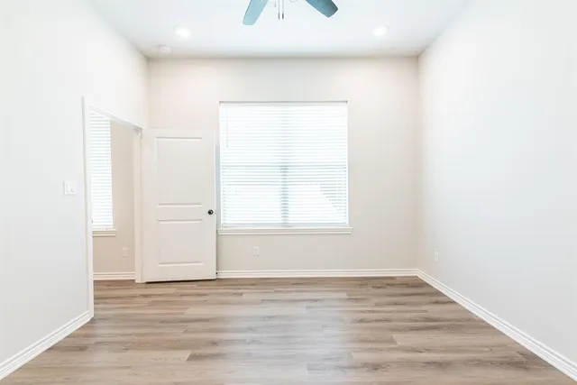 a bathroom with a granite countertop double vanity sink and mirror
