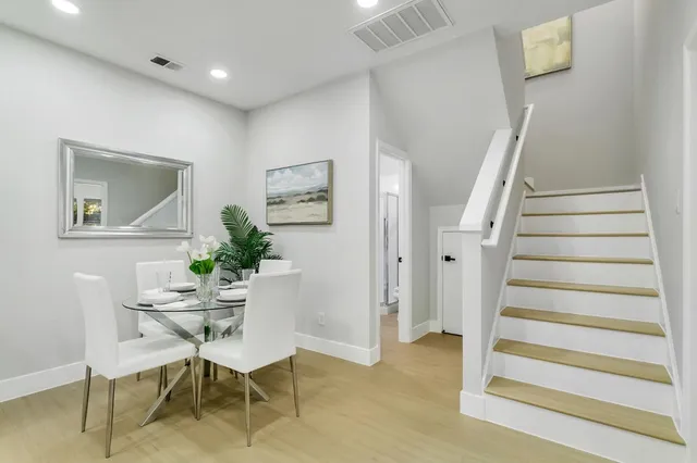 a view of a livingroom with furniture and wooden floor