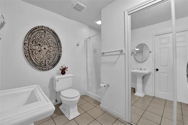 a bathroom with a toilet and a sink