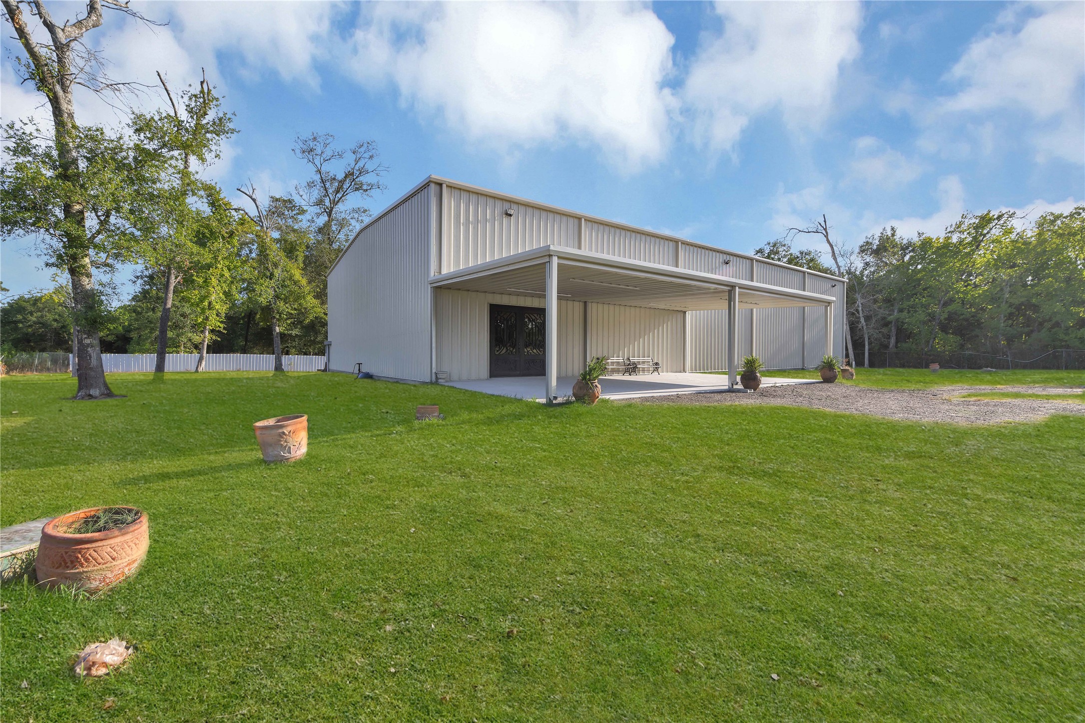 16326 Bear Bayou Drive Channelview, TX 77530 - Photo 27 of 50 a view of a house with a yard porch and sitting area