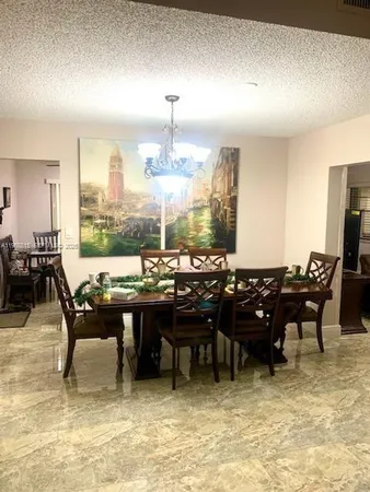 a view of a big dining room with furniture