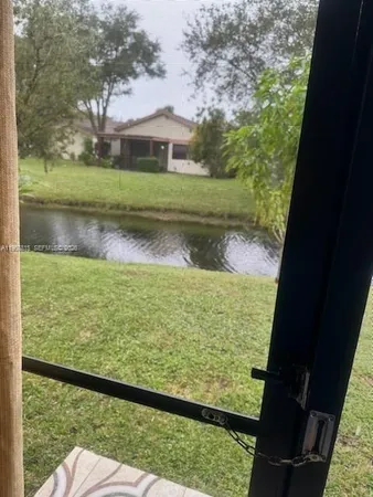 a view of balcony with yard