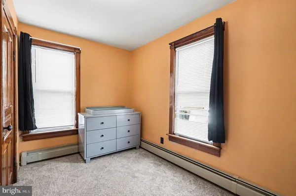 a room with window and cabinet