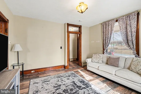 a living room with furniture and a rug