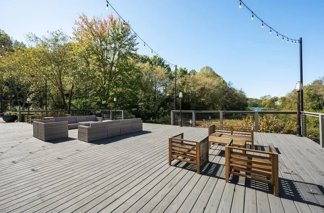 a view of roof deck with furniture