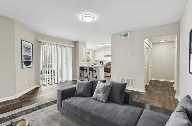 a living room with furniture and a table