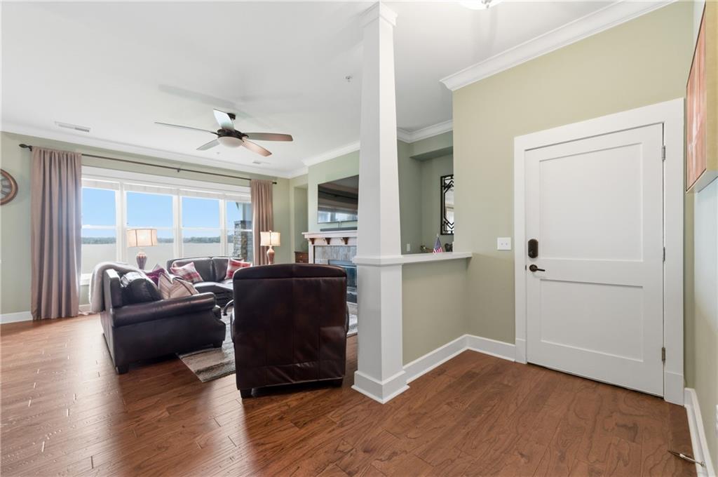 117 South Bay Road, Unit 402 Eatonton, GA 31024 - Photo 23 of 48 a living room with furniture and a wooden floor