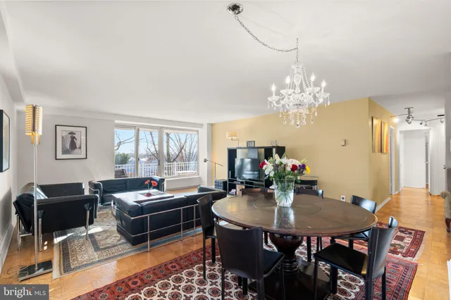 a living room with furniture a rug and a flat screen tv