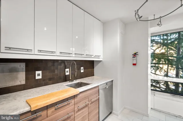 a kitchen with a sink and refrigerator