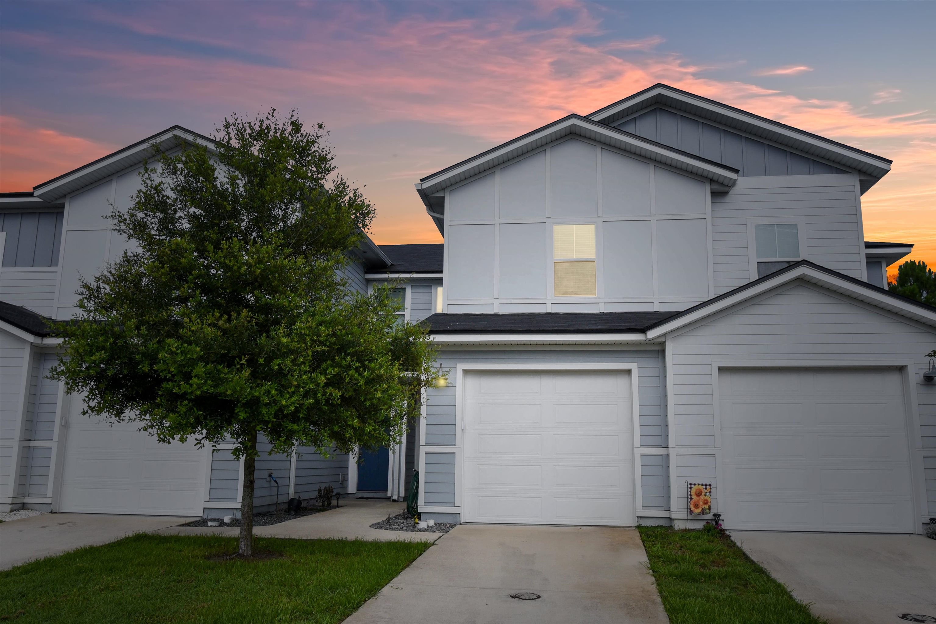 105 Ridge Lake Road St. Augustine, FL 32086 - Photo 6 of 34 a front view of a house with a garden