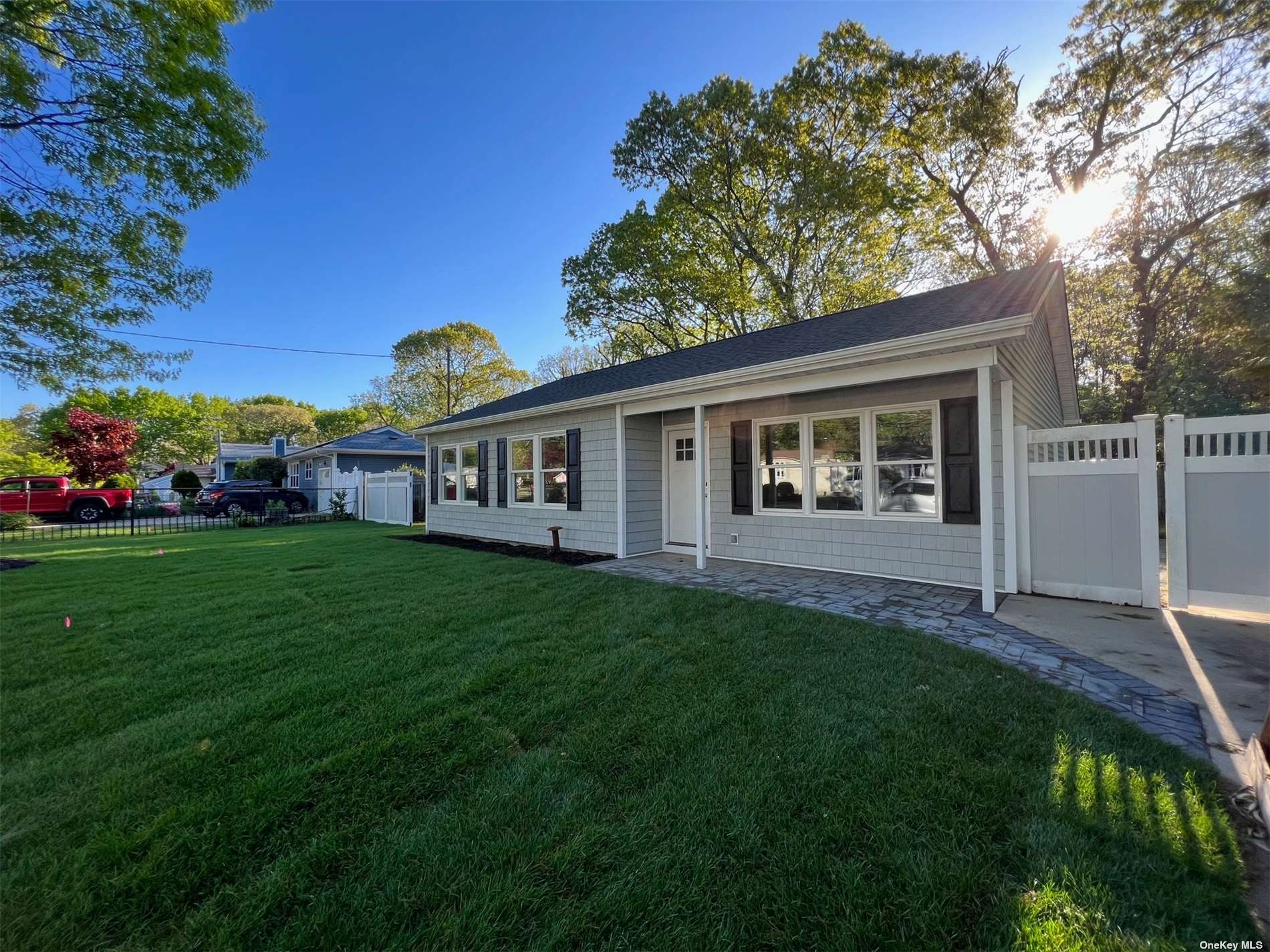 a view of house with backyard and garden