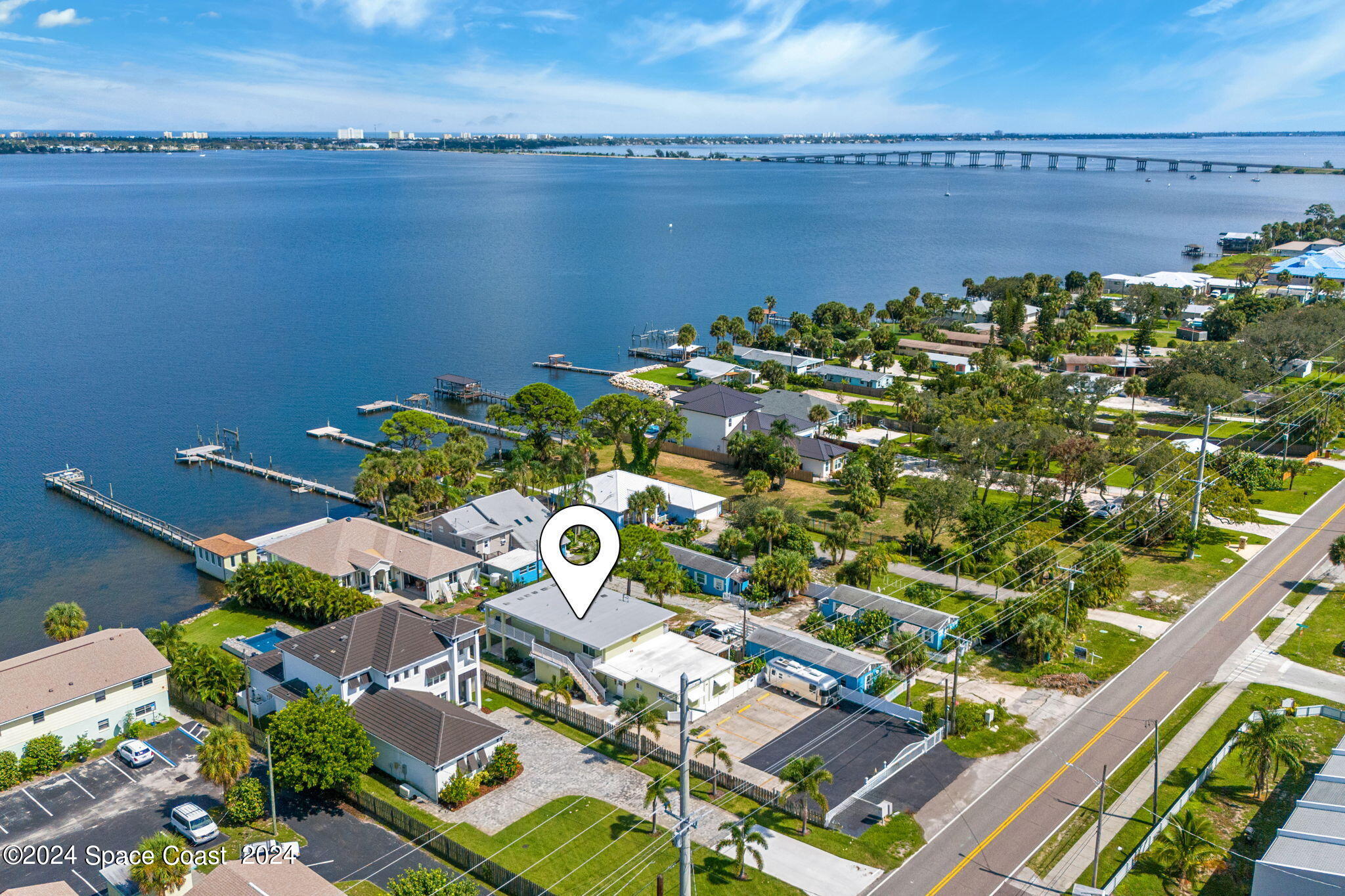 2189 Pineapple Avenue, Unit C Melbourne, FL 32935 - Photo 46 of 67 an aerial view of a house with a lake view