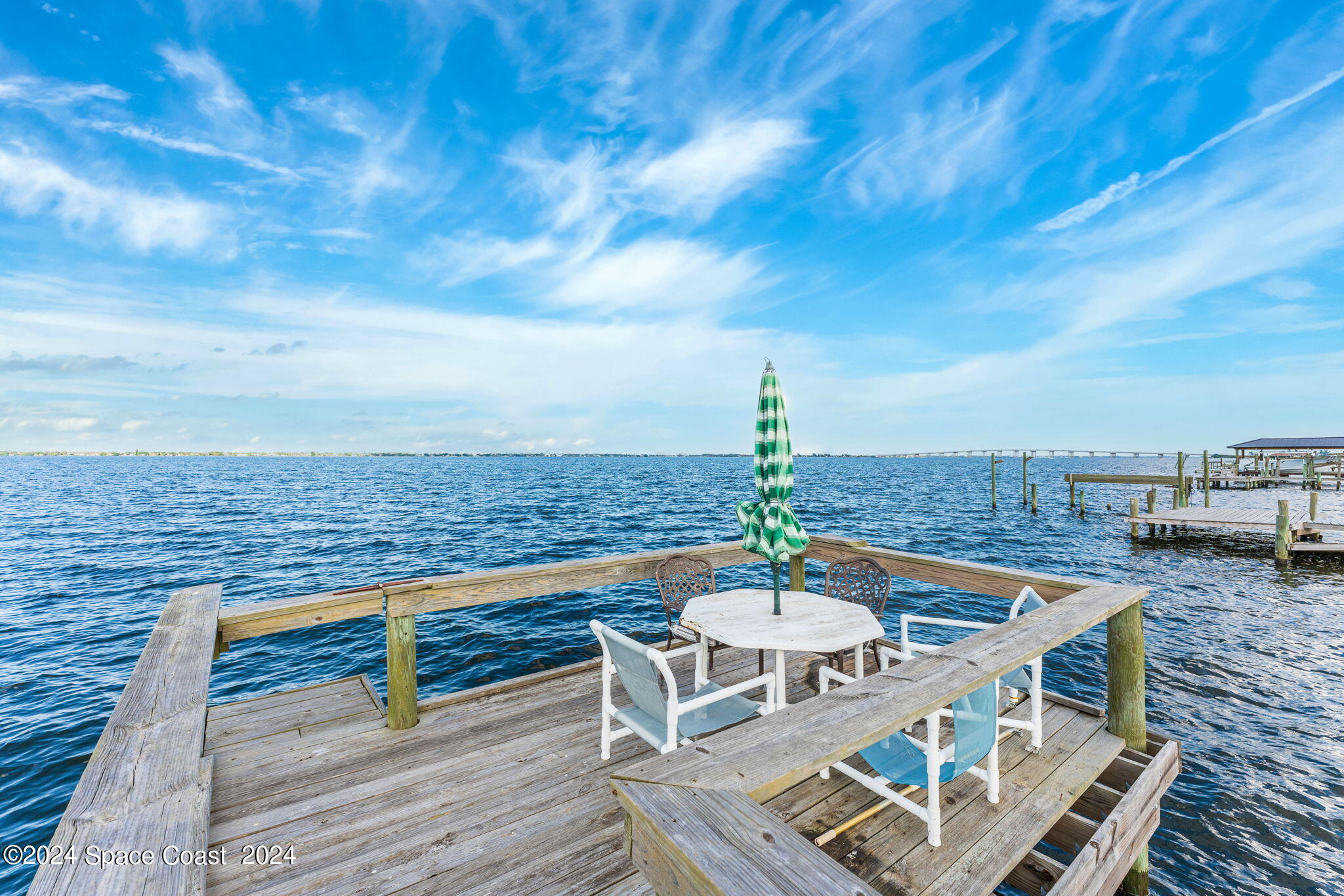 2189 Pineapple Avenue, Unit C Melbourne, FL 32935 - Photo 6 of 67 a view of a terrace with wooden floor and city view