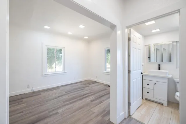 a bathroom with a sink a mirror and a shower