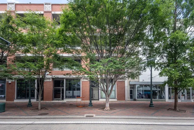 front view of a building with a garden