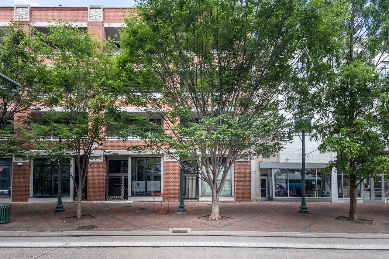front view of a building with a garden
