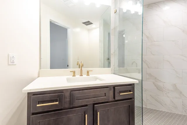 a bathroom with a sink and a mirror