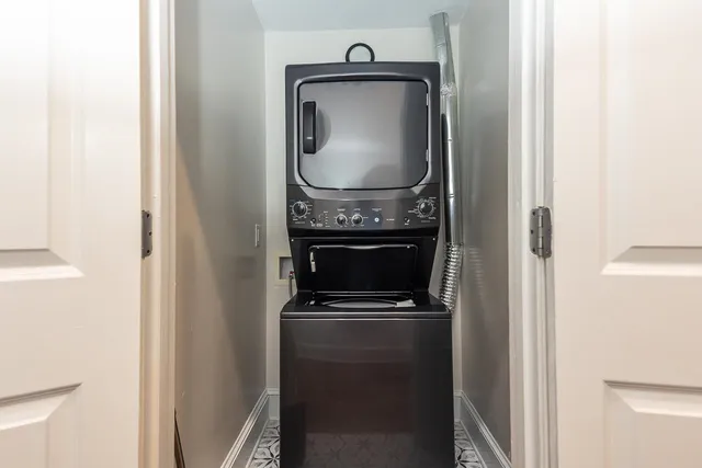 a close view of a utility room with dryer and washer
