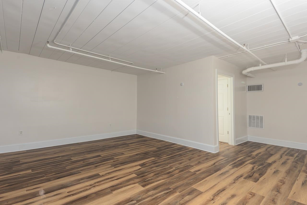 95 South Main Street, Unit 101 Memphis, TN 38103 - Photo 22 of 26 a view of a room with wooden floor