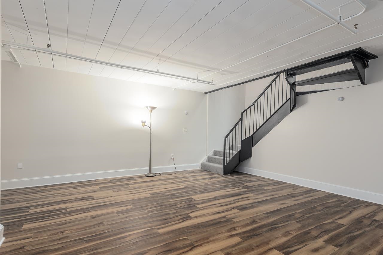 95 South Main Street, Unit 101 Memphis, TN 38103 - Photo 23 of 26 a view of empty room with wooden floor and fan