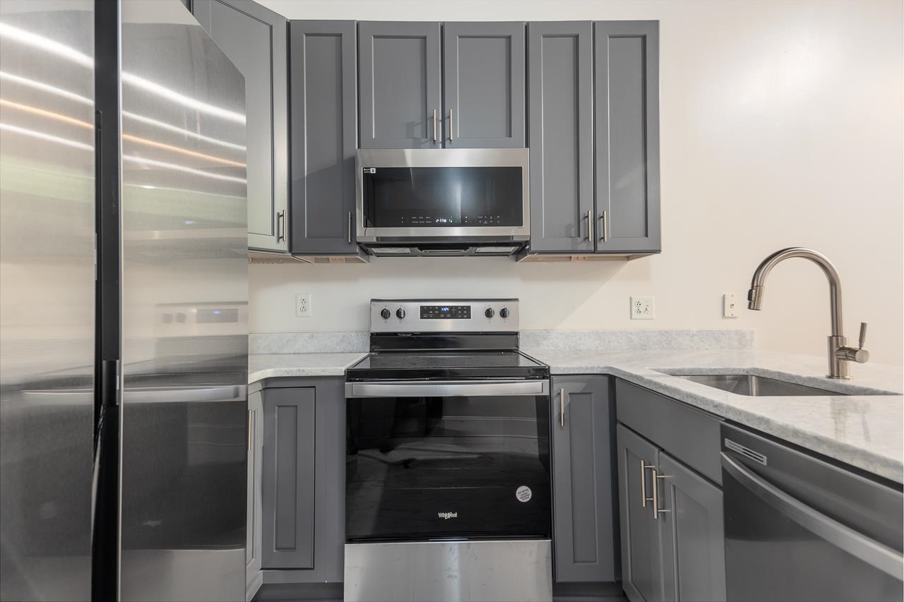 95 South Main Street, Unit 101 Memphis, TN 38103 - Photo 5 of 26 a kitchen with a sink and a stove top oven