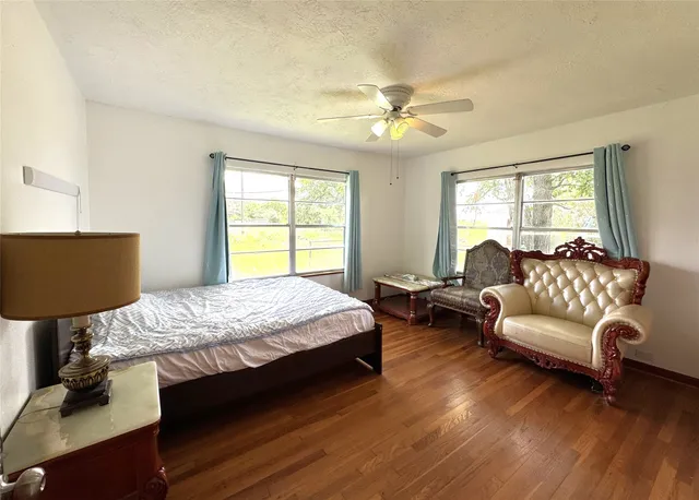 a bedroom with a bed and a couch