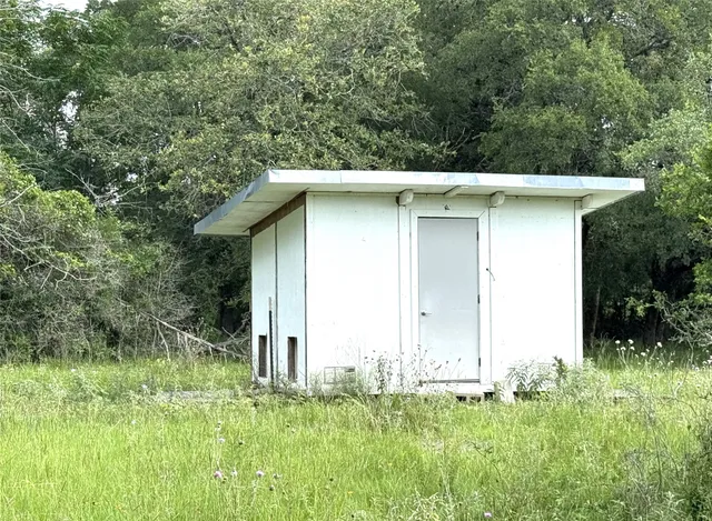 a house with trees in the background