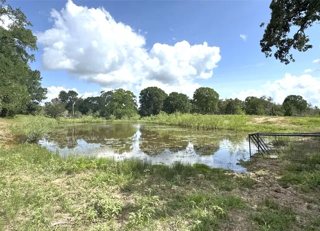 a view of a lake with a yard