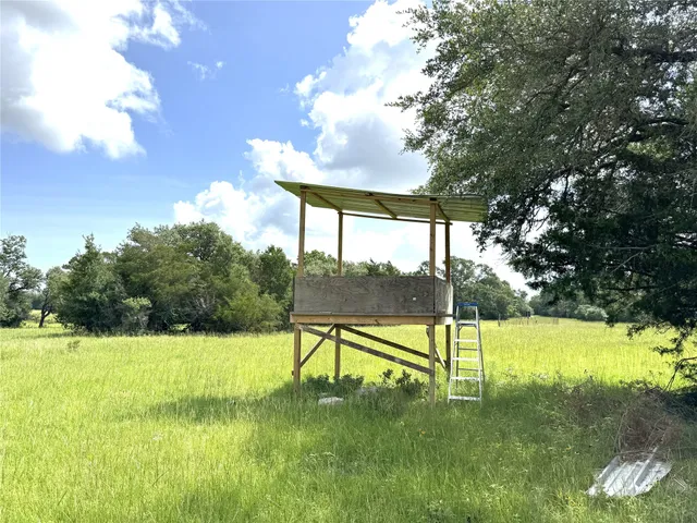a view of swimming pool with a yard