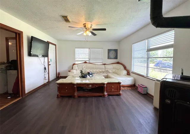 a bed room with wooden floor and furniture