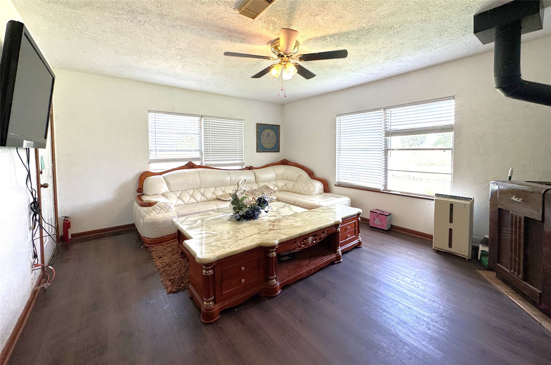 1435 Shaws Bend Road Columbus, TX 78934 - Photo 8 of 36 a spacious bedroom with a bed and a chandelier